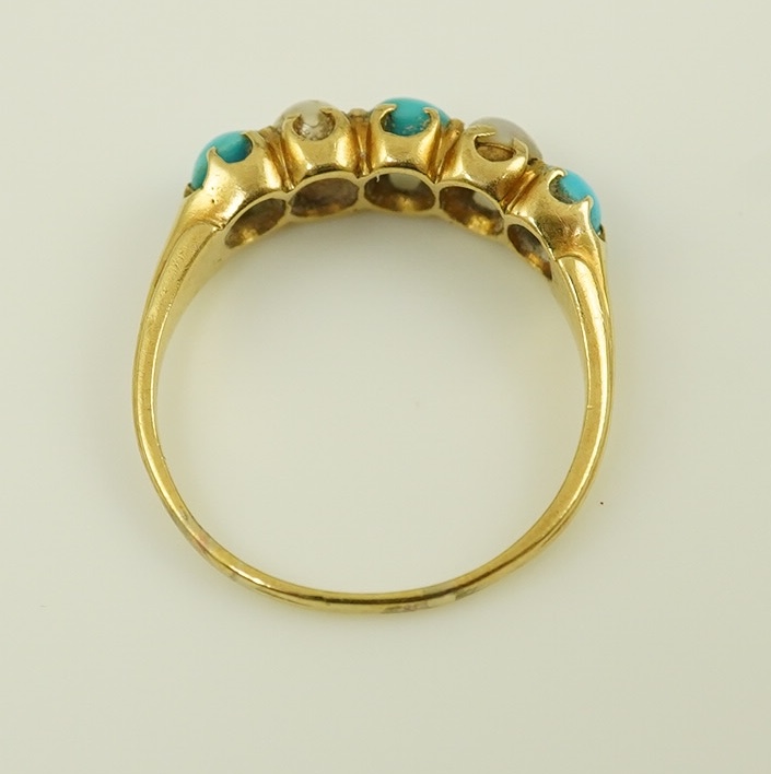 An early 20th century gold, three stone turquoise and two stone split pearl set half hoop ring